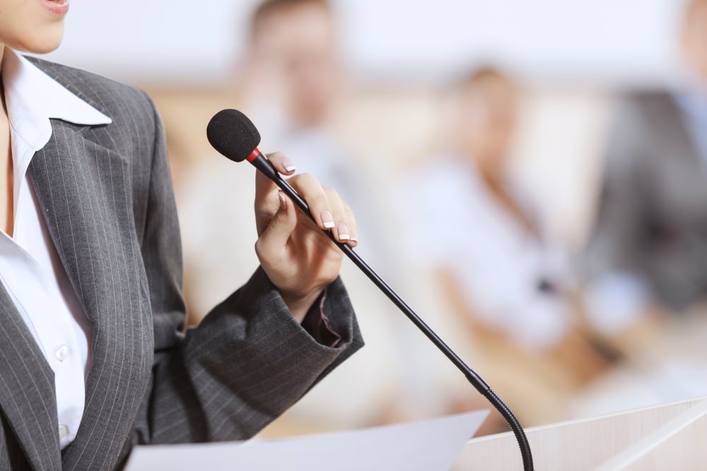 woman, holding mic