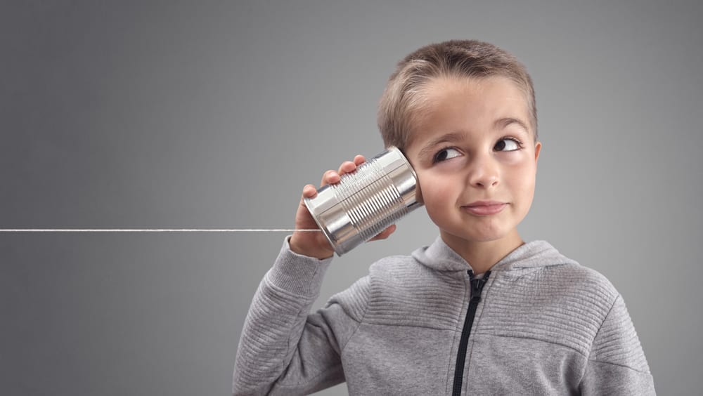 kid listening through can