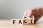 hand fixing fake blocks to "fact"