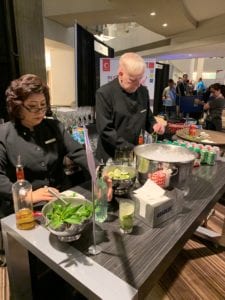 Bartenders serving up Infovision Social's signature mojitos