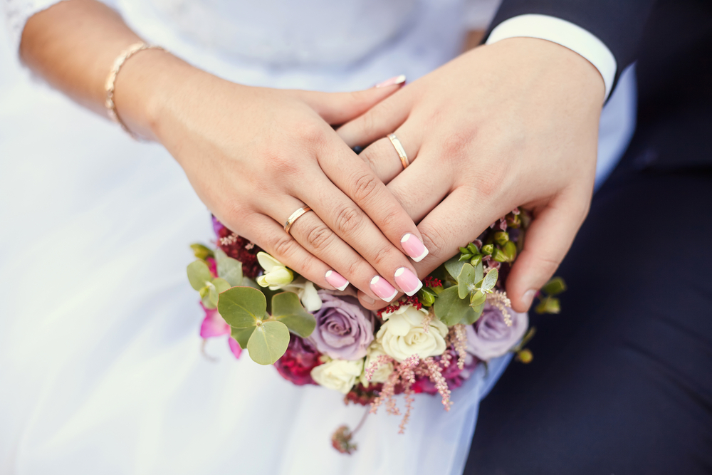 hands with wedding rings